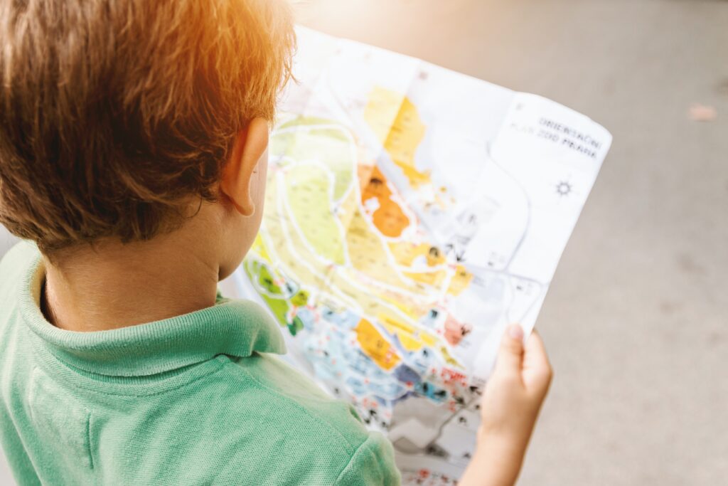 Child reading a map