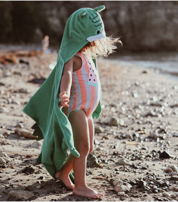toddler girl in beach towel