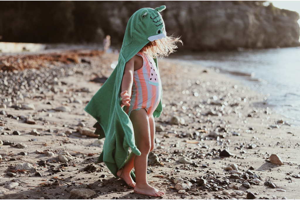 toddler girl in beach towel